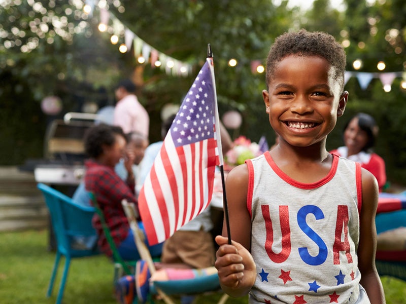 Labor Day celebration boy with flag
